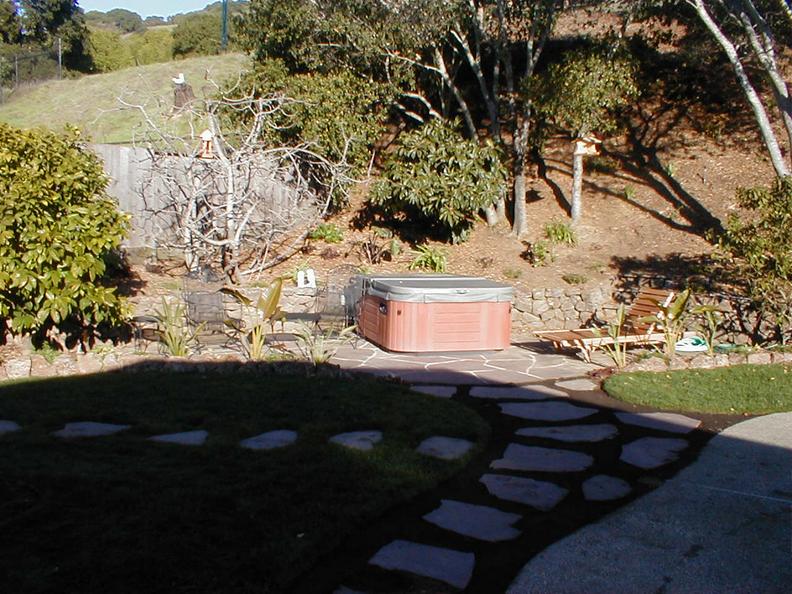 After- Boulders, Pavers, New Sod & Rock Retaining Wall