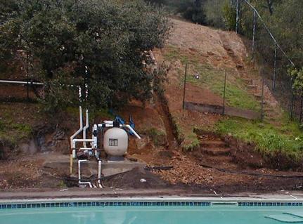 Before- Rock Retaining Wall, Pavers, Pump House, Fence & New Sod